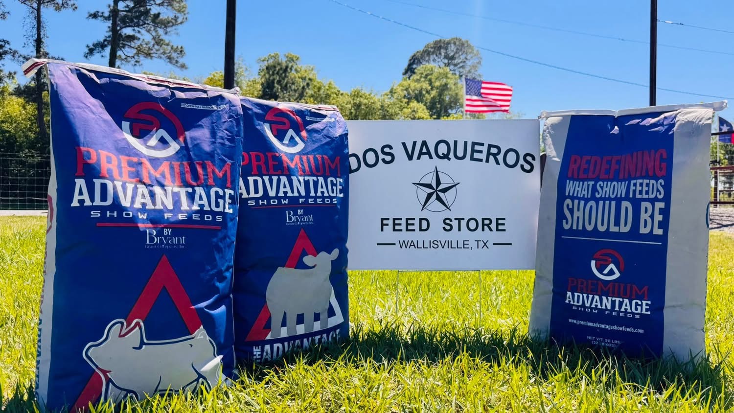 Show feed bags displayed beside the Dos Vaqueros sign